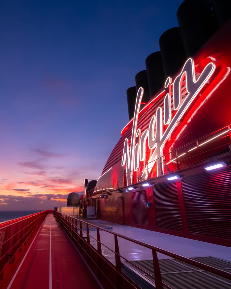 The Virgin sign on deck at dusk