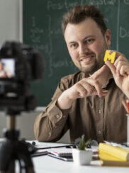 Teacher doing an english lesson online for his students