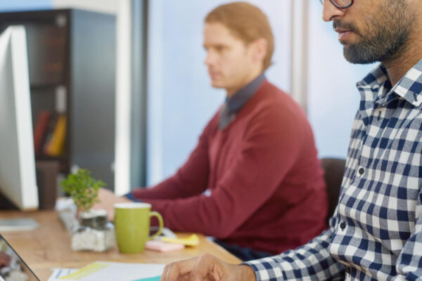Laptop typing and business man in office for email report or planning