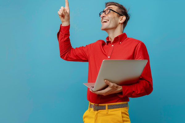 Man with laptop having idea min